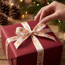 Artikel Geschenkband mit Lebkuchenfiguren aus Polyester, 25 mm x 18 m, Weiß-Orange