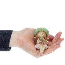 Artikel Kantenhocker Mädchen mit Hund aus Polyresin Ø4,5cm H9,5cm in Rosa und Grün