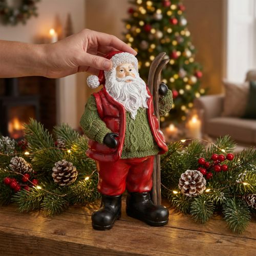 Weihnachtsmann Dekofigur mit Ski aus Polyresin 14×10,5×24,5cm Rot/Grün | Floristik24.at
