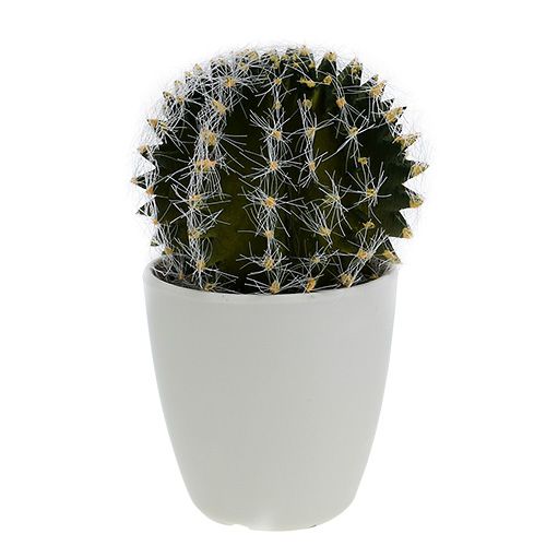 Ein künstlicher grüner Kaktus in einem Topf steht neben einem
